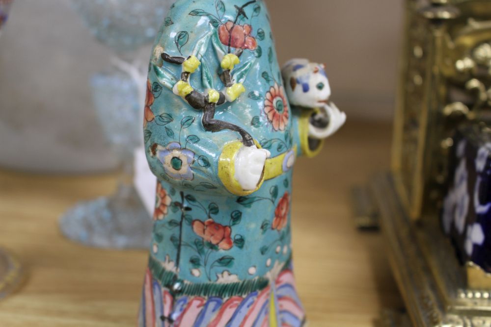 A near pair of Chinese polychrome-decorated figural incense burners and another similar incense burner, Jiaqing period (1796-1820)